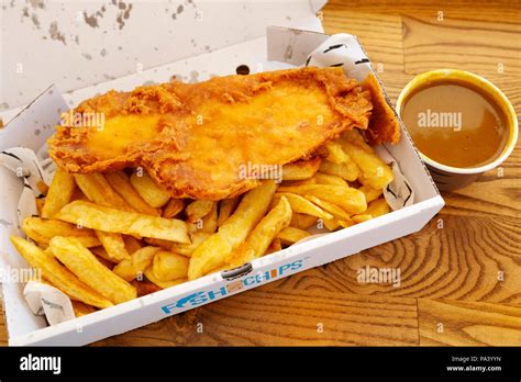Fish And Chips Served With Curry Sauce At Tynemouth In England The