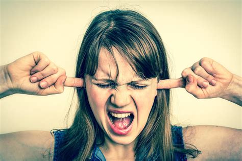 Woman Covering Her Ears To Protect From Loud Noise Stock Image Image Of Listening Frustration