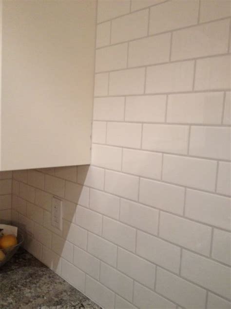 The grey grout is then bleeding into it slightly and looking a bit messy on the cut tiles. white mosaic tile gray grout - Google Search | White mosaic tile, Grey grout, Mosaic tiles