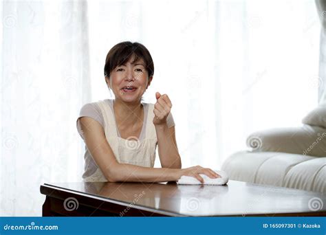 Middle Aged Asian Woman Stock Image Image Of Home Kneeling 165097301