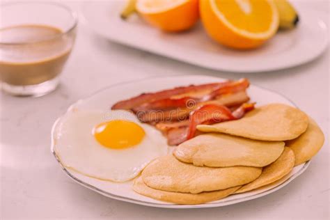 Healthy Full American Breakfast With Eggs Bacon And Pancakes Stock