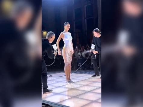 bella hadid and her spray on dress turn heads at paris fashion week