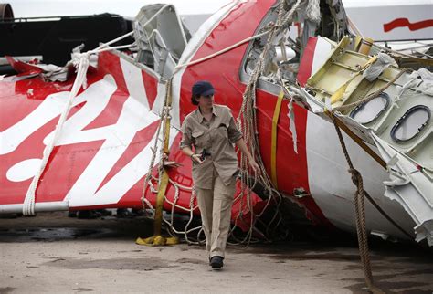 The plane was a new model and had only been used for two months. Divers Pull More Bodies From AirAsia Wreckage, Including ...