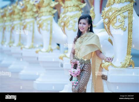 beautiful thai girl in traditional dress costume in phra that choeng chum thailand temple stock