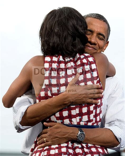 President Barack Obama Hugs First Lady Michelle Obama After Etsy