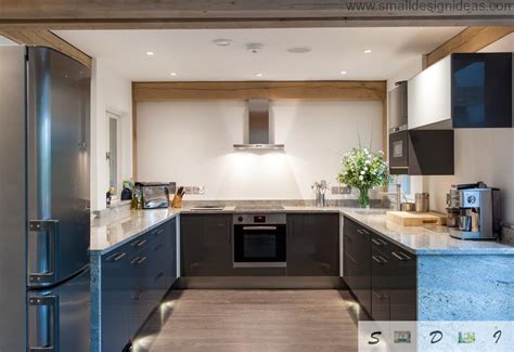 It features two adjoining walls that hold all the countertops, cabinets, and kitchen services, with the other two adjoining walls open. Modern Medium and Large Kitchen Layout Ideas