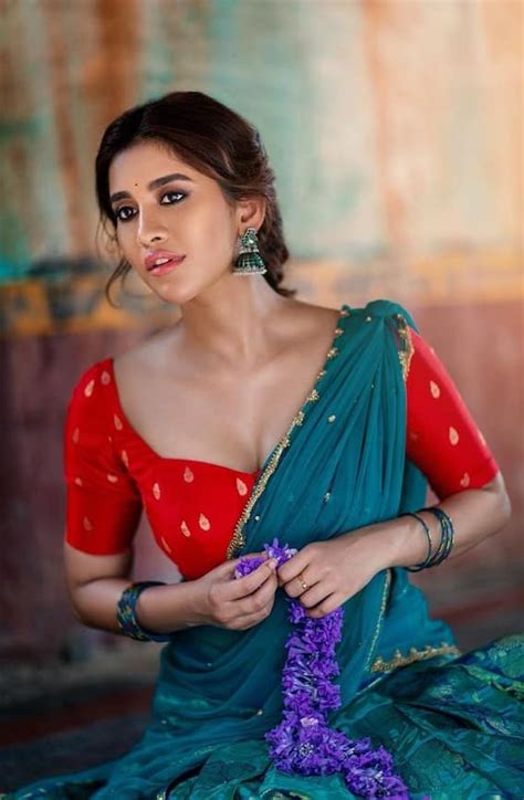 Nabha Natesh Looks Cute In Traditional Half Saree Photos Nabha Natesh Photos పల్లె పడుచులా