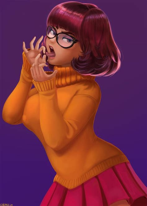 A Woman With Glasses Is Talking On Her Cell Phone While Wearing An Orange Sweater And Pink Skirt