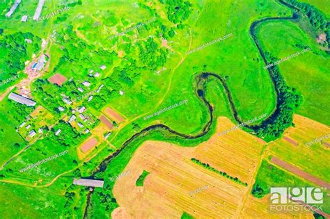 Top Aerial View Of The Natural Rural Landscape Valley Of A Meandering