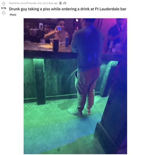 drunk guy taking a piss while ordering a drink at ft lauderdale bar drunk guy pissing at bar