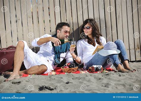 Young Couple Enjoying Picnic On The Beach Stock Photo Image Of