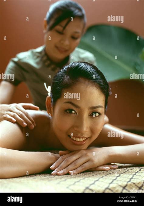 Couple At Spa In Northern Thailand Female Black Hair Off Face Lying On