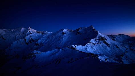 2048x1152 Dark Blue Sky Above Snow Covered Mountain 2048x1152
