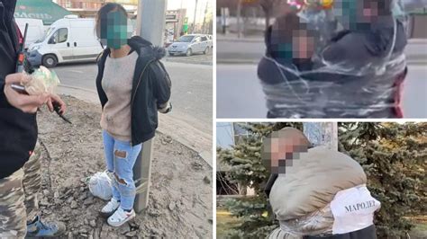ukraine accused looters stripped beaten in public in graphic videos au — australia