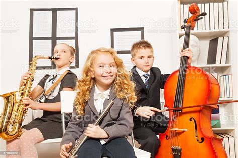 Happy Children Play Musical Instruments Together Stock Photo And More