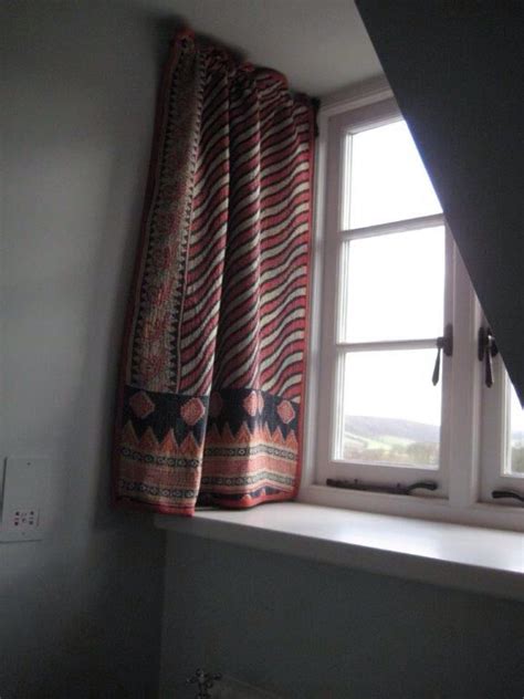 Drapery Arms Are A Useful Way Of Hanging Curtains In A Dormer Window