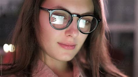 woman with glasses eyes looking at the monitor by stocksy contributor nikita sursin stocksy