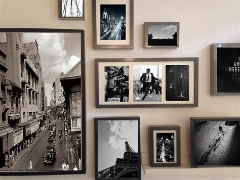 Black And White Photographs Are Hanging On The Wall Next To Pictures