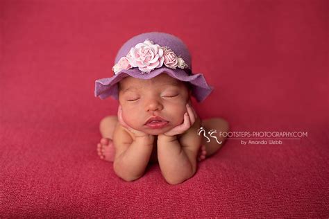 purple and pearls newborn session footsteps photography newborn photographer near raf