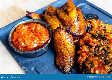 Nigerian Food Delicious Fried Plantain With Red Chilli Souce Stock