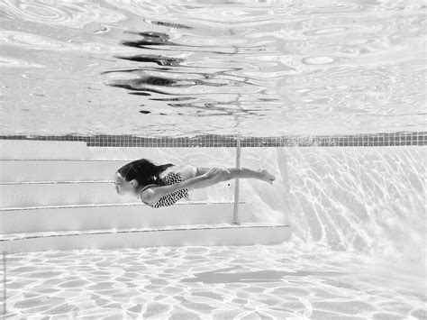 Girl Underwater In Swimming Pool By Stocksy Contributor Ronnie