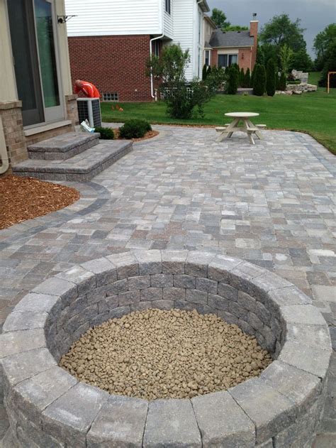 It's made up of small, rounded stones about 3/8 of an inch in diameter. Stone Patio With Built in Fire Pit