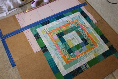 Measure the width of the quilt top in the center squaring up block units, finger pressing and matching centers allow these borders to come together nicely. How to square up huge quilt blocks. - Rossie Crafts