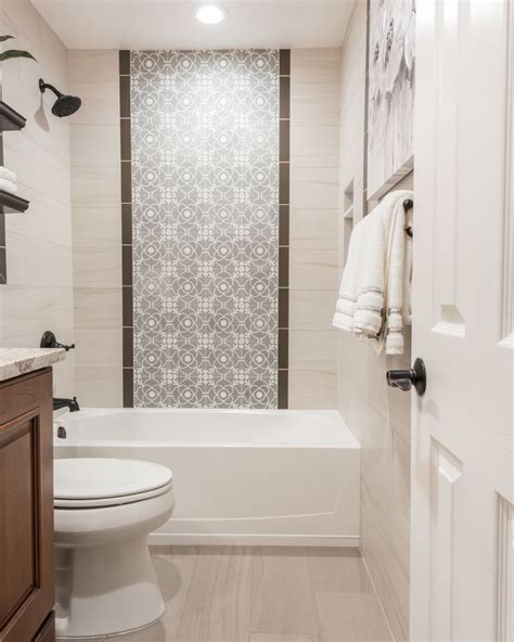 Seeking the best informative concepts in the internet? The shower wall features a center panel with accent tiles ...