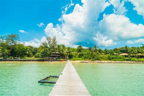 Wooden Pier Or Bridge With Tropical Beach And Sea In Paradise Is Stock