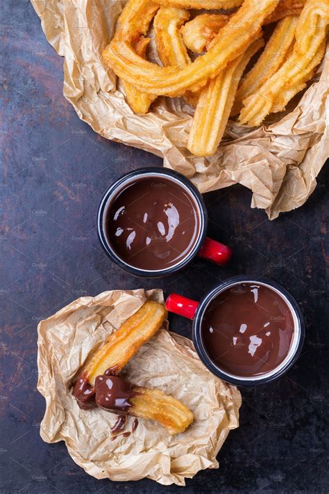 Traditional spanish churros with hot chocolate in a mug | High-Quality ...