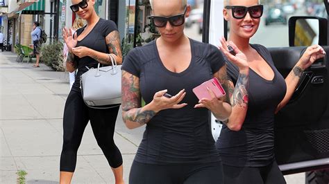Amber Rose Flaunts Her Curves As She Climbs Out Of Her Hot Pink Jeep