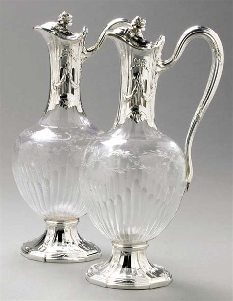 A Pair Of French Silver Mounted Glass Claret Jugs Mark Of Puiforcat