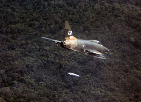 A F 100d Aircraft Dropping A Napalm Bomb Near Bien Hoa