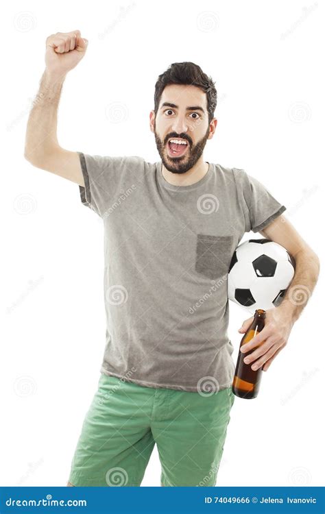 Young Man Holding Soccer Ball In Hand Hes Happy And Looking At Camera