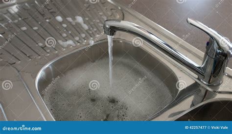 Running Water Over Kitchen Sink Royalty Free Stock Photography CartoonDealer Com