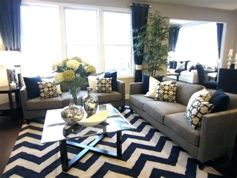 Another color you can also match with navy blue is yellow. Living Room Layout And Decor Blue Grey Yellow Color ...