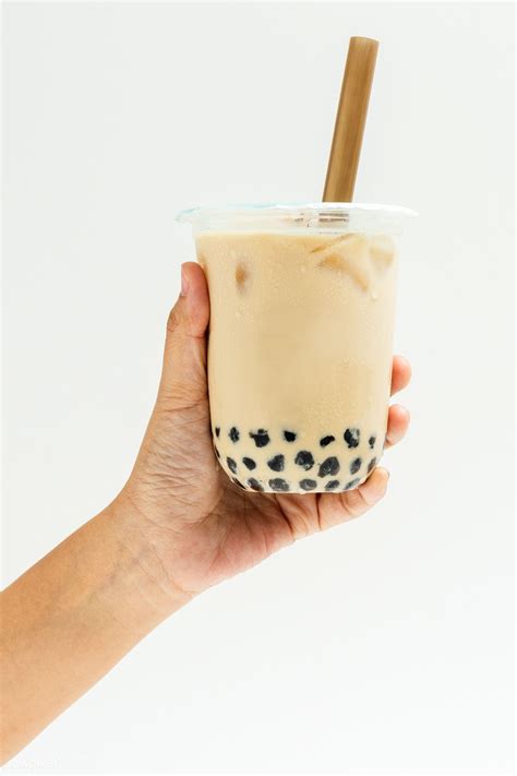 Download Premium Image Of Woman Holding A Cup Of Bubble Milk Tea