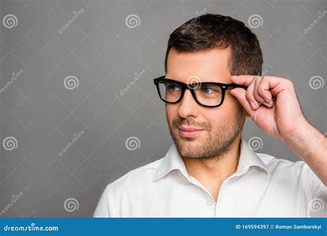 Smart Man Touching His Glasses And Looking Ahead Stock Image Image Of