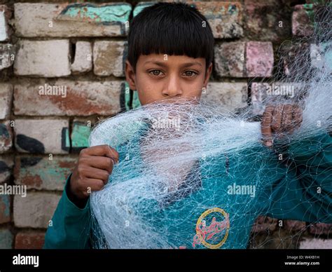 Varanasi India Circa November 2018 Portrait Of Kid From A Fishing