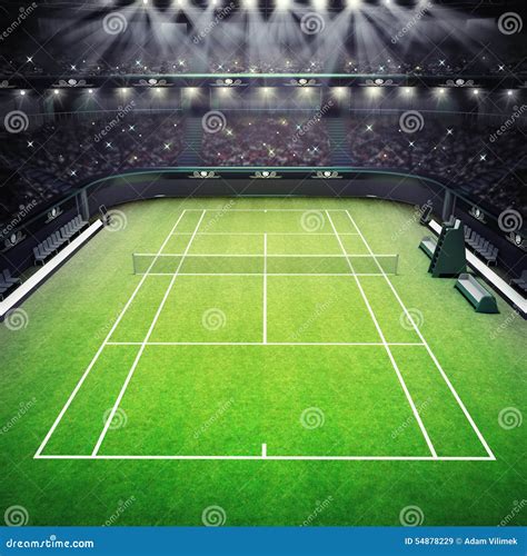 Grass Tennis Court And Stadium Full Of Spectators With Spotlights Stock