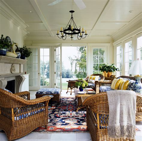 The floor features a geometric pattern, and the ceiling offers up a fun, bright splash of color. Marvelous wicker ottoman in Sunroom Traditional with ...