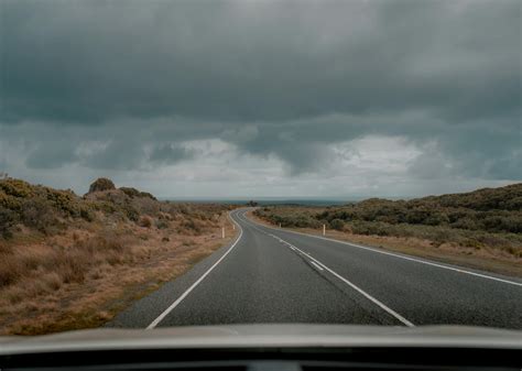Gray Asphalt Road Under Gray Cloudy Sky · Free Stock Photo