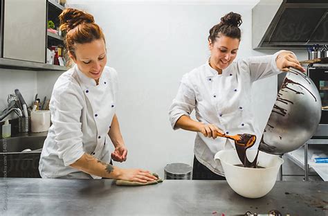 Two Women Pastry Chef Working In A Professional Kitchen By Giorgio