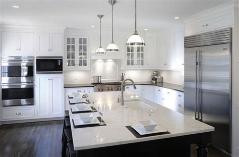 For a dramatic effect, decorate your kitchen in black and white. Transitional White Kitchen w/ Black Island - Transitional ...