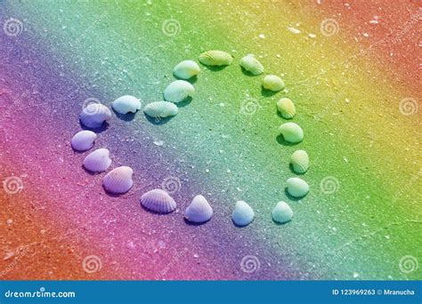 Heart Shape Made Of Shells On The Rainbow Colorful Sandy Beach F Stock