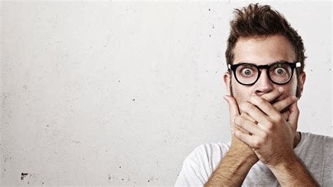 Shocked Man Covering His Mouth With Hands Stock Photo Download Image