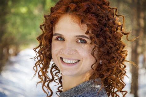 On A Bright Sunny Day In The Forest A Curly Red Haired Girl Stock
