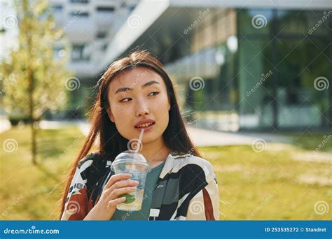 Portrait Of Young Asian Woman That Is Outdoors At Daytime Stock Photo
