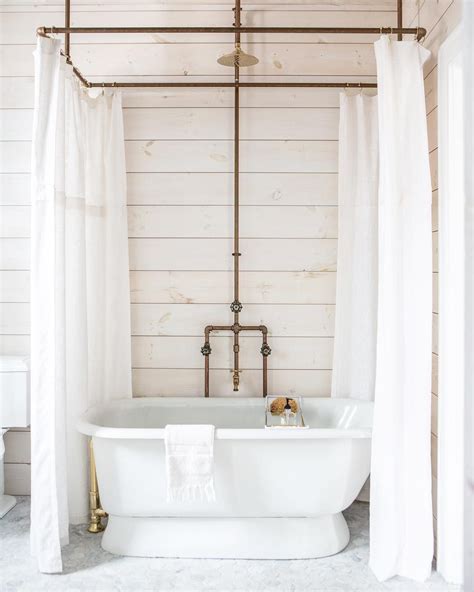 I'm a sucker for used or industrial items used unconventionally—for a purpose other their intended use. circular copper shower rod and handles | Diy shower curtain, Shower tub, Clawfoot tub shower