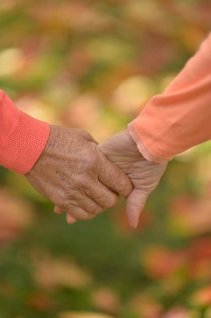 Premium Photo Senior Couple Holding Hands Together